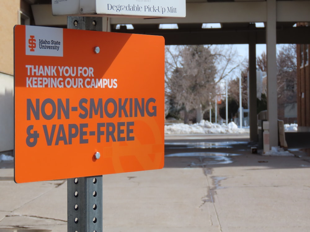 a no smoking and vape free sign in front of a building
