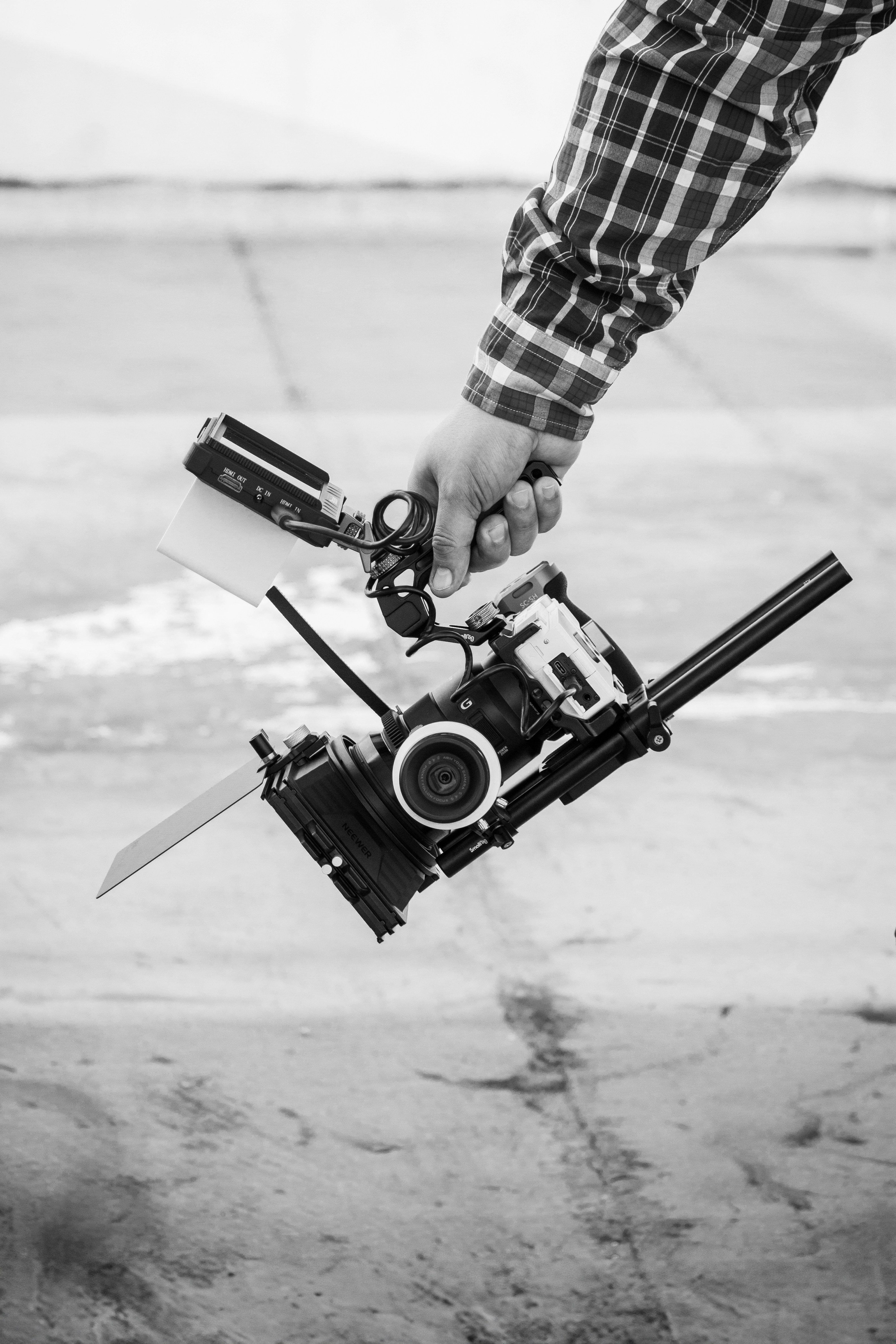 a person holding a camera and a video camera