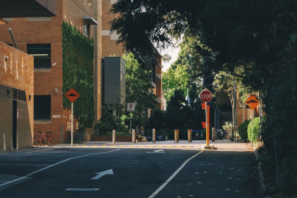 an empty street with a stop sign on the corner