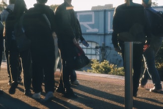 a group of people standing next to each other