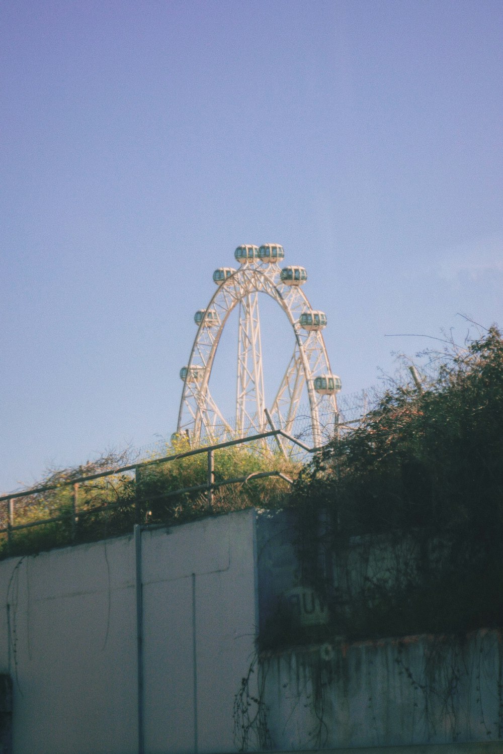 a ferris wheel sitting on top of a building
