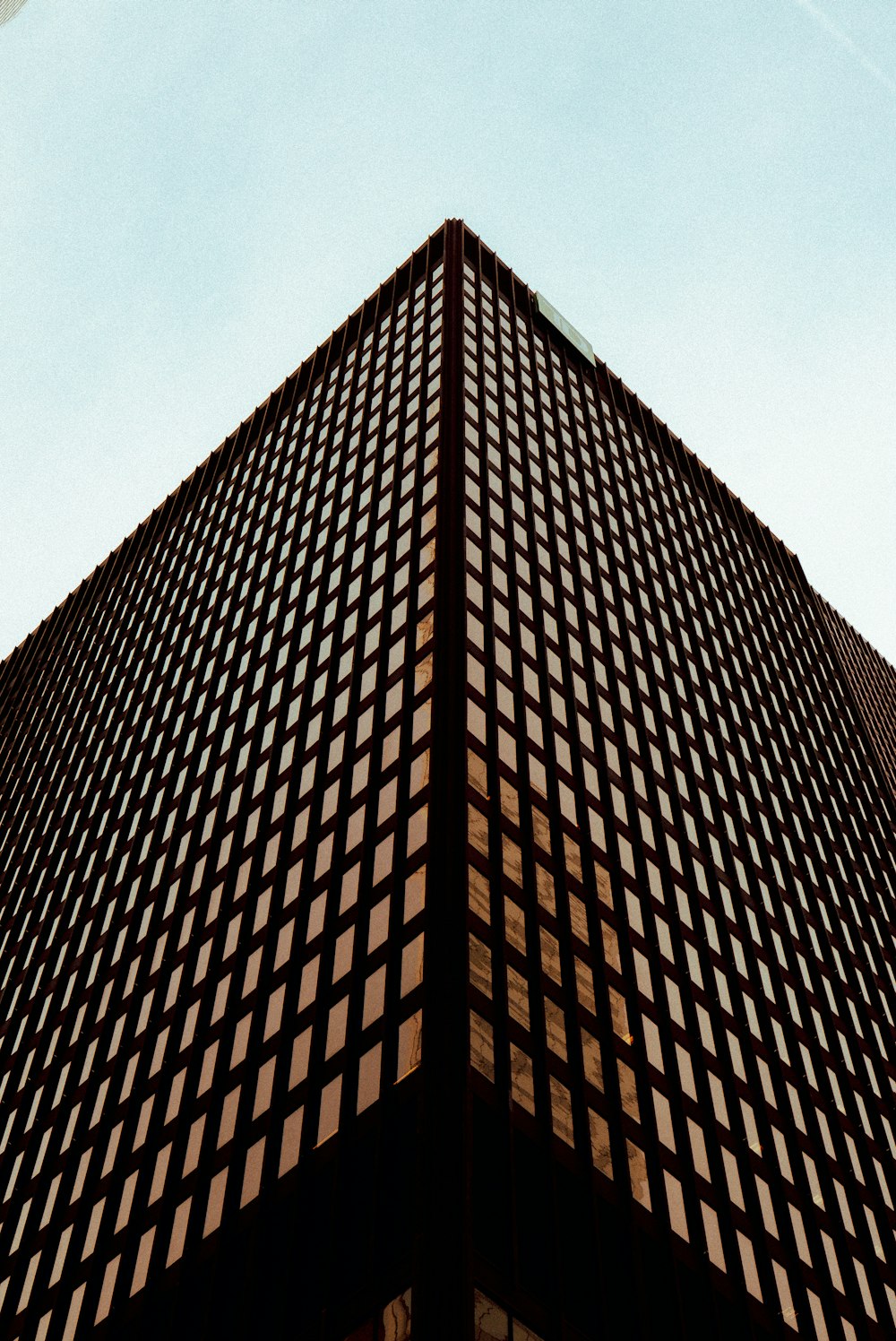 a very tall building with a sky in the background