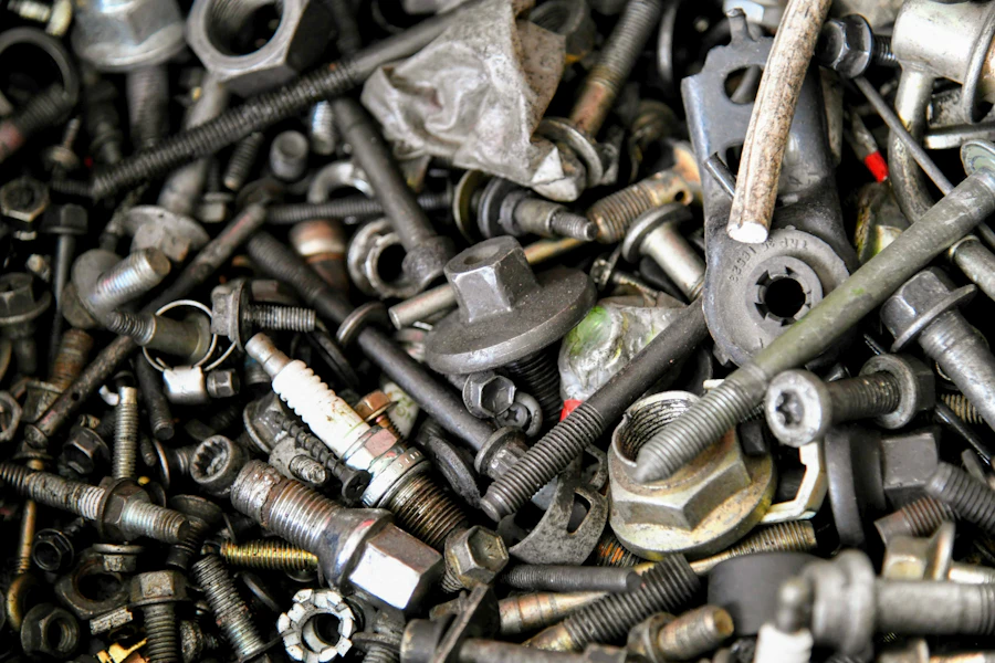 Pile of assorted metal nuts and bolts