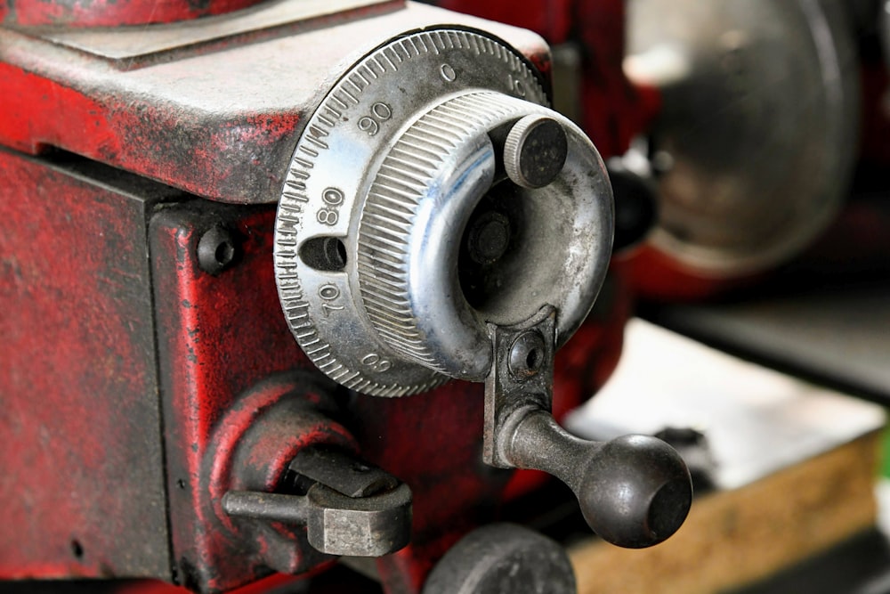 a close up of a red and black machine