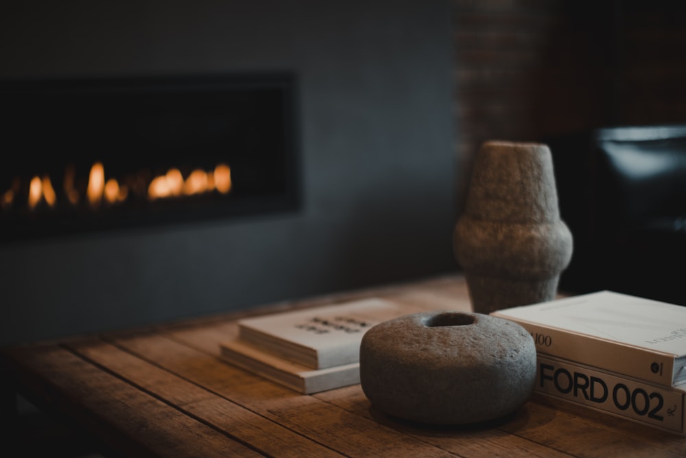 a table with a book and a candle on it