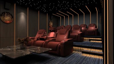 a room filled with red chairs and a table