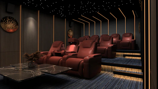 a room filled with red chairs and a table