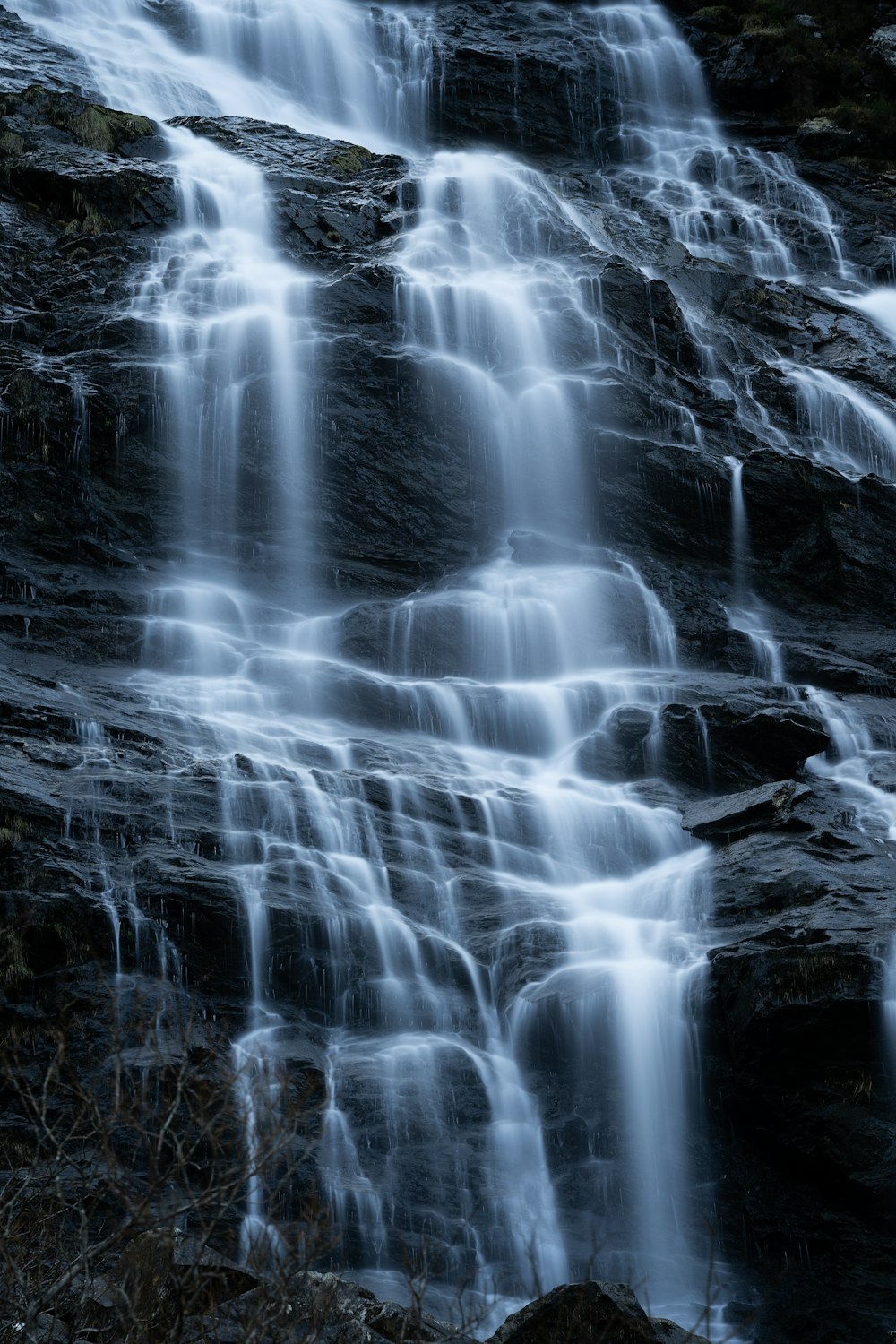 a very tall waterfall with lots of water