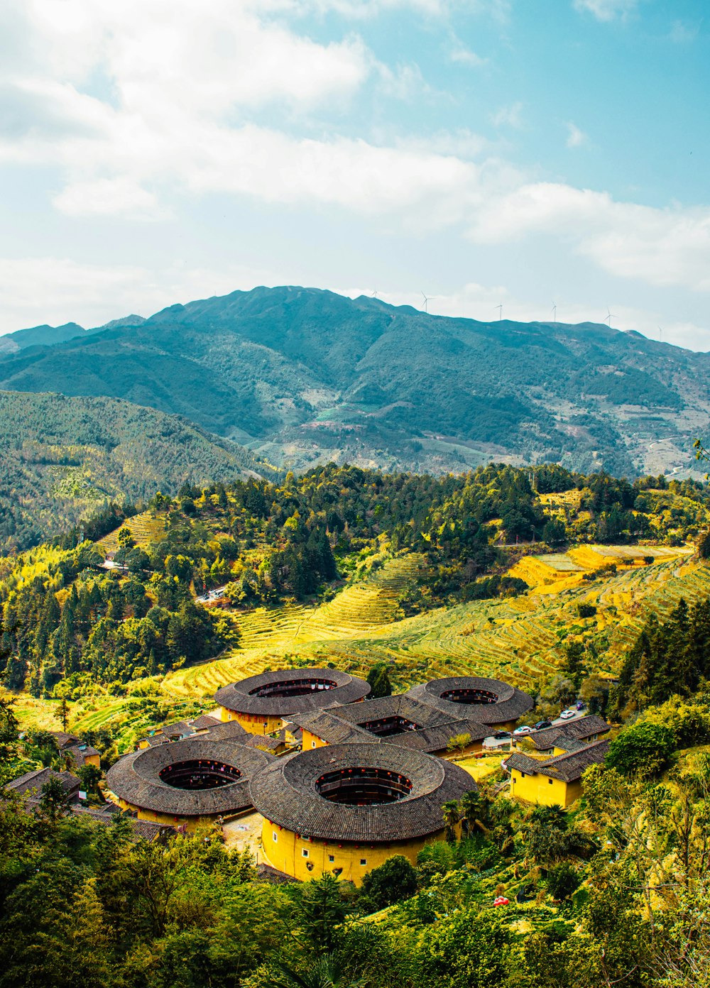 an aerial view of a village in the mountains