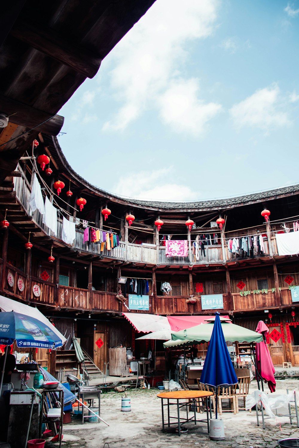 a building with a lot of tables and umbrellas