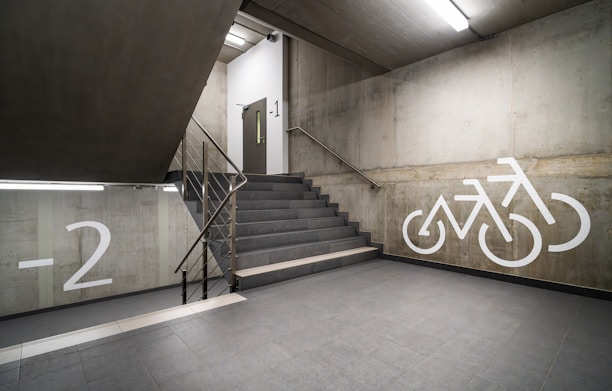 a staircase with a bicycle painted on the wall