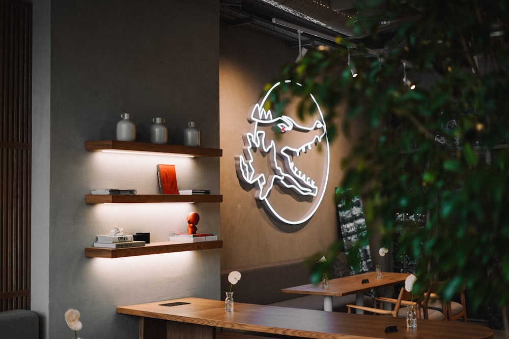 a restaurant with a large neon sign on the wall