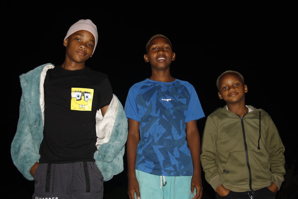 a group of young men standing next to each other