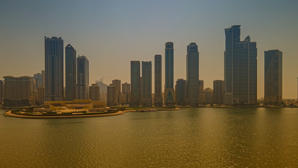 a large body of water with a city in the background