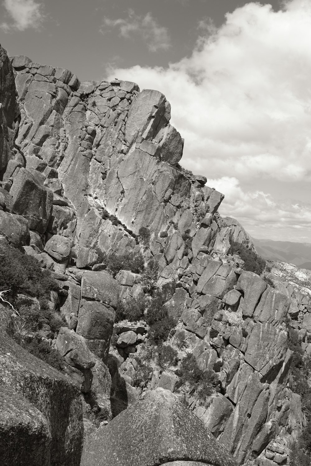 a black and white photo of a rocky mountain