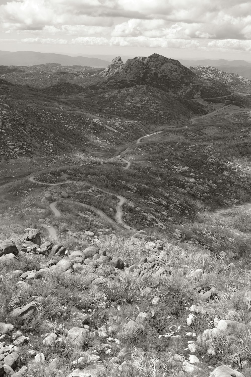 a black and white photo of a mountain range