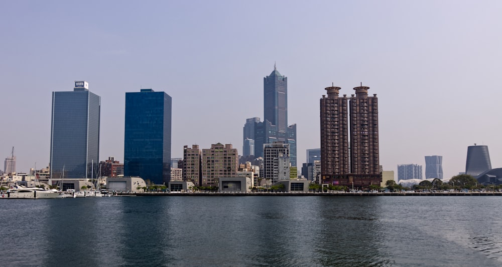 a large body of water with a city in the background