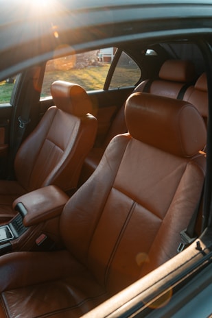 the interior of a car with the sun shining through the window