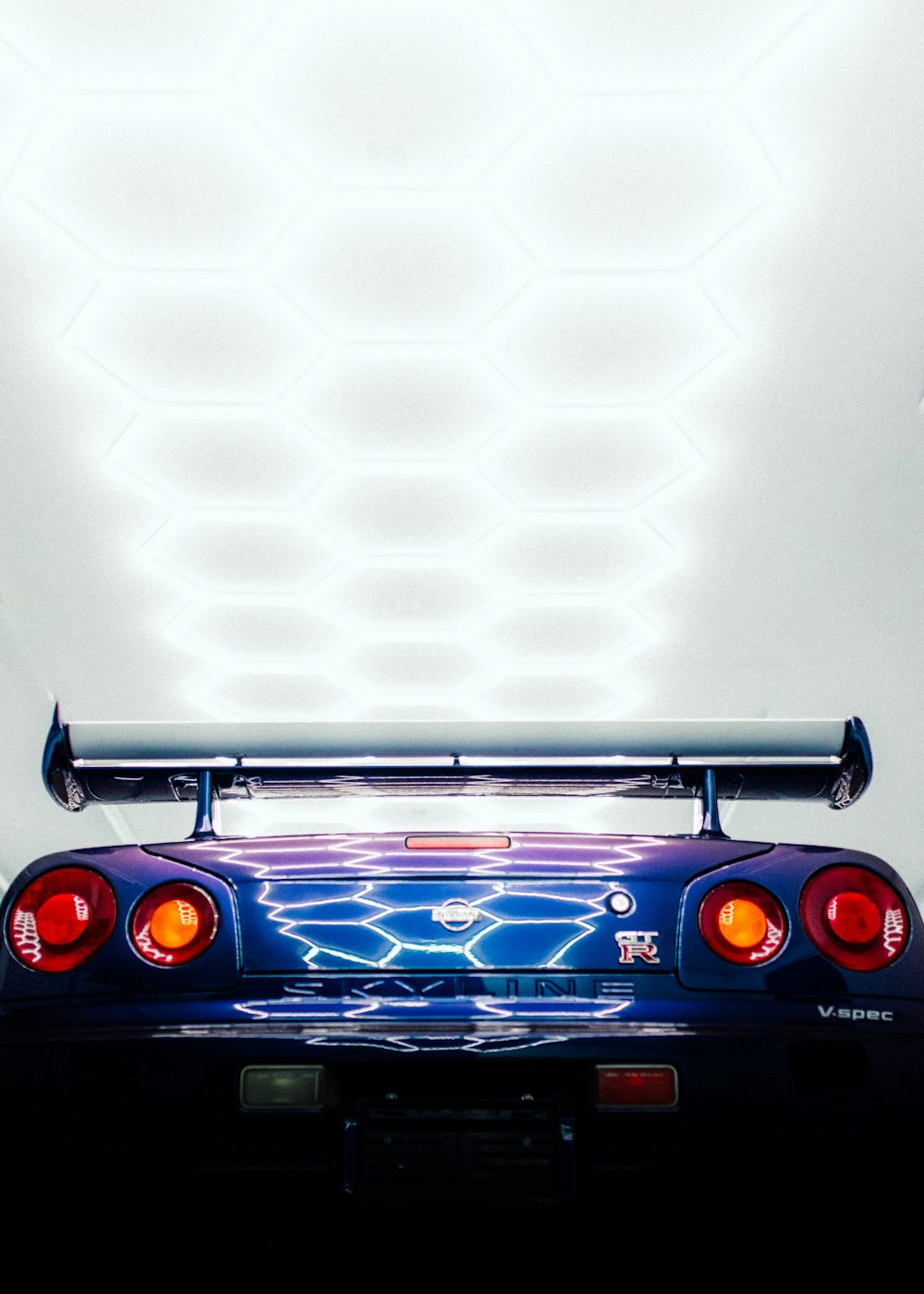 the back end of a car with its lights on