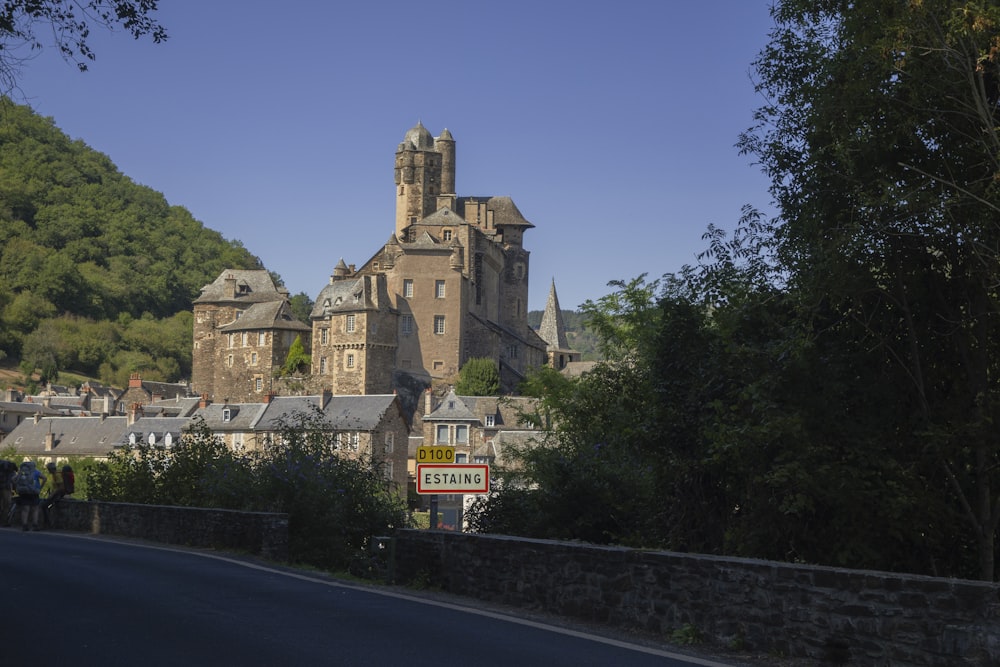 a large castle like building sitting on the side of a road