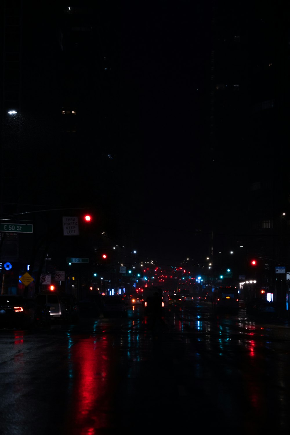 a city street at night with a lot of traffic