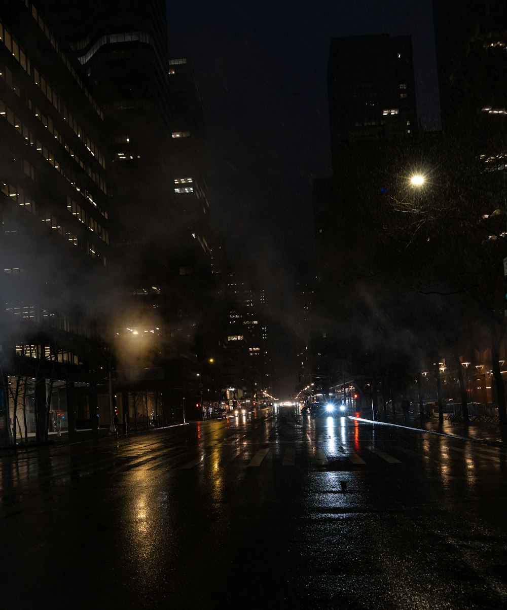 a city street at night with a lot of traffic