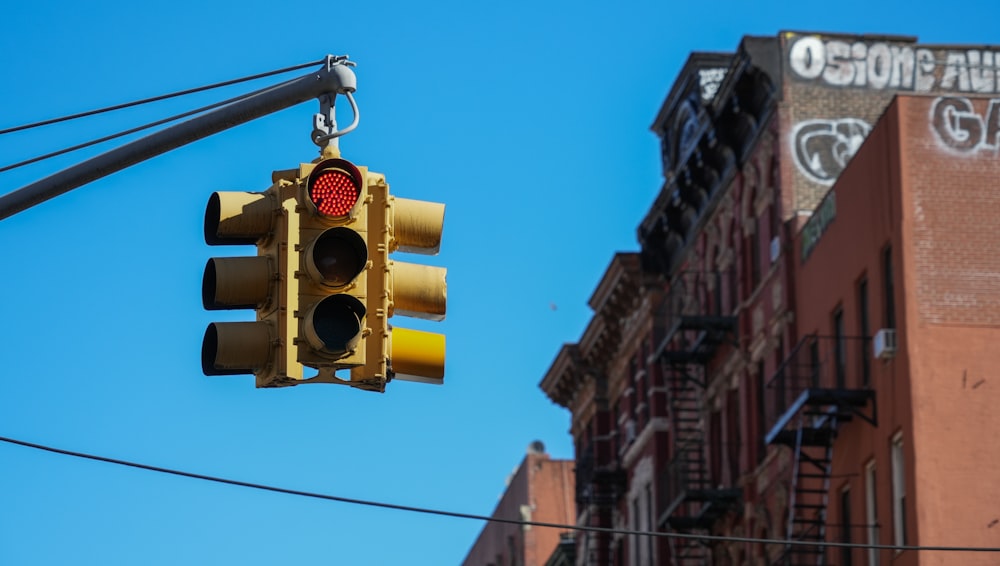 a traffic light hanging off the side of a building