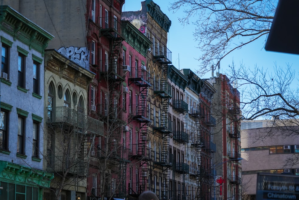 a row of multicolored buildings on a city street