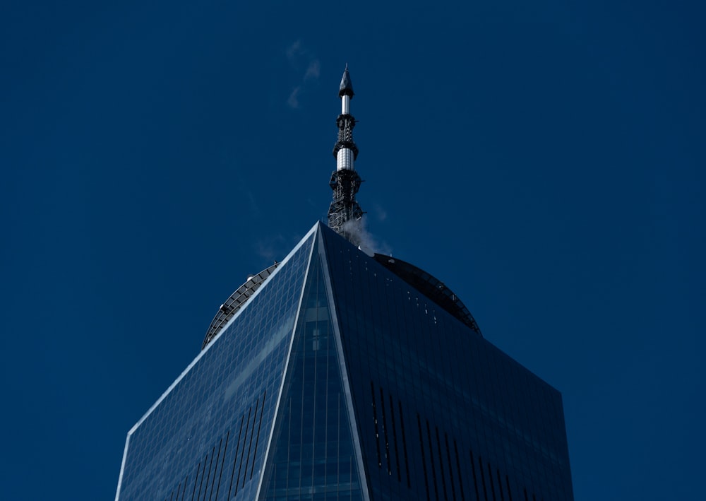 a tall building with a sky scraper on top of it