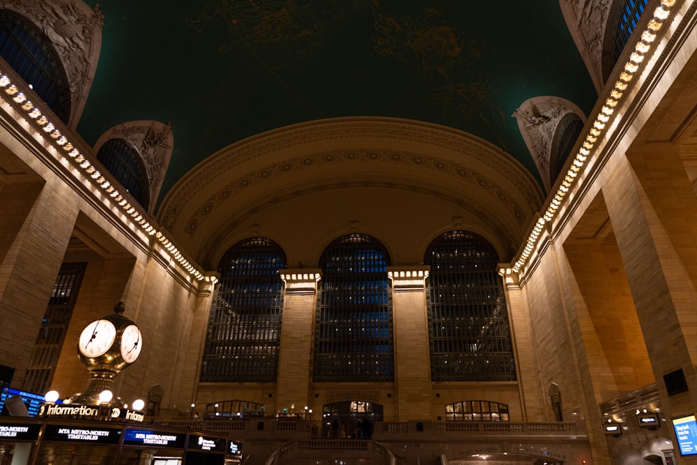 a train station with a lot of lights on the ceiling