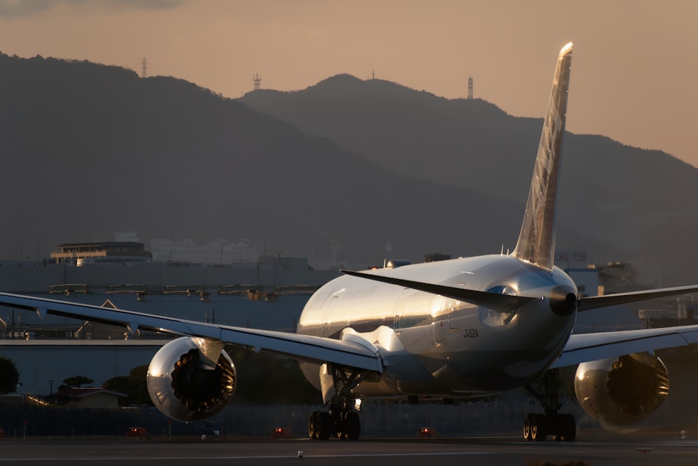 a large jetliner sitting on top of an airport tarmac