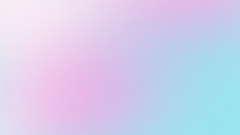 a blurry image of a pink and blue background