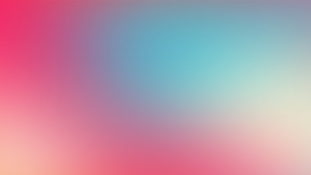 a blurry image of a pink and blue background