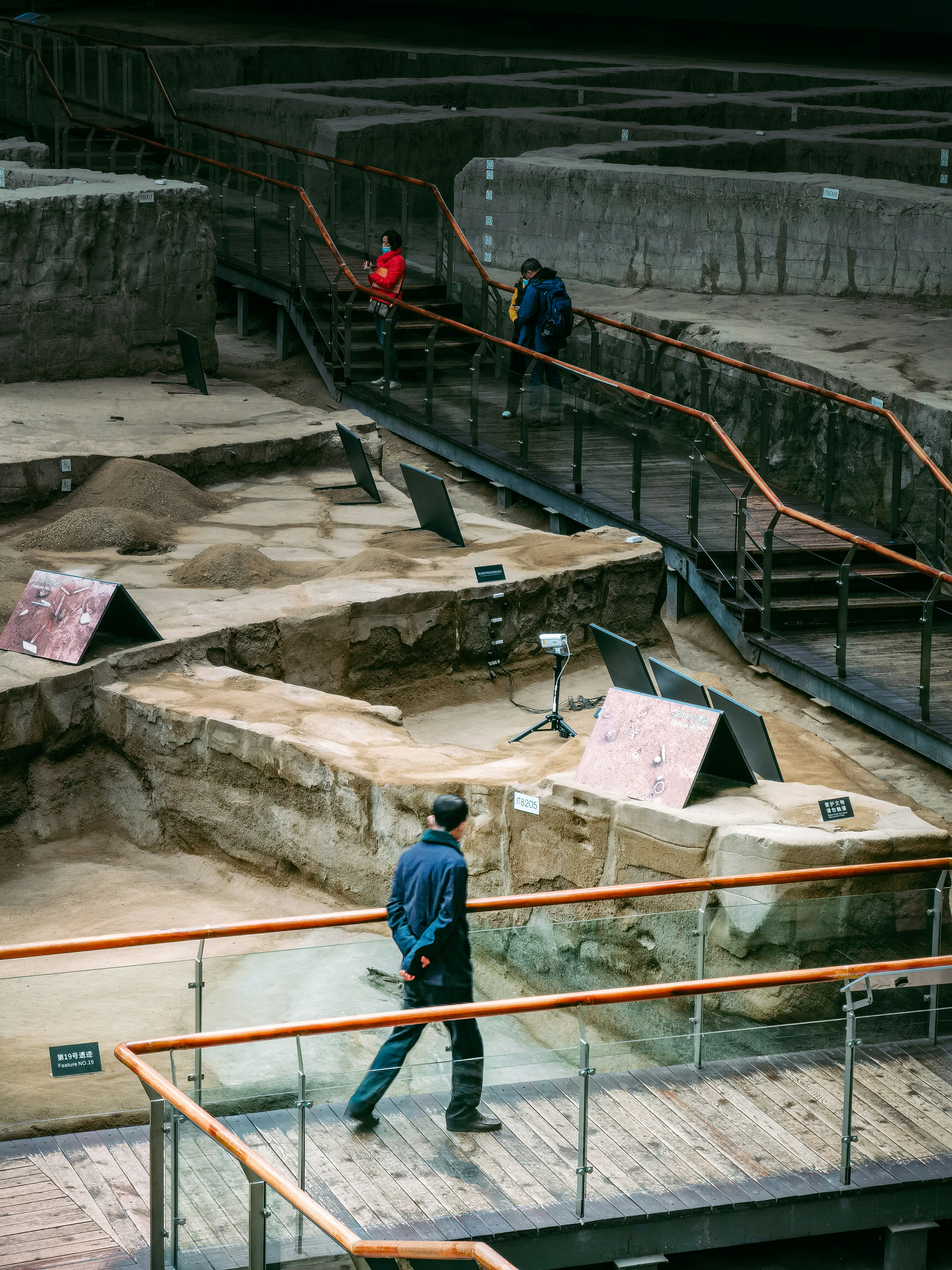 a man standing on top of a wooden ramp