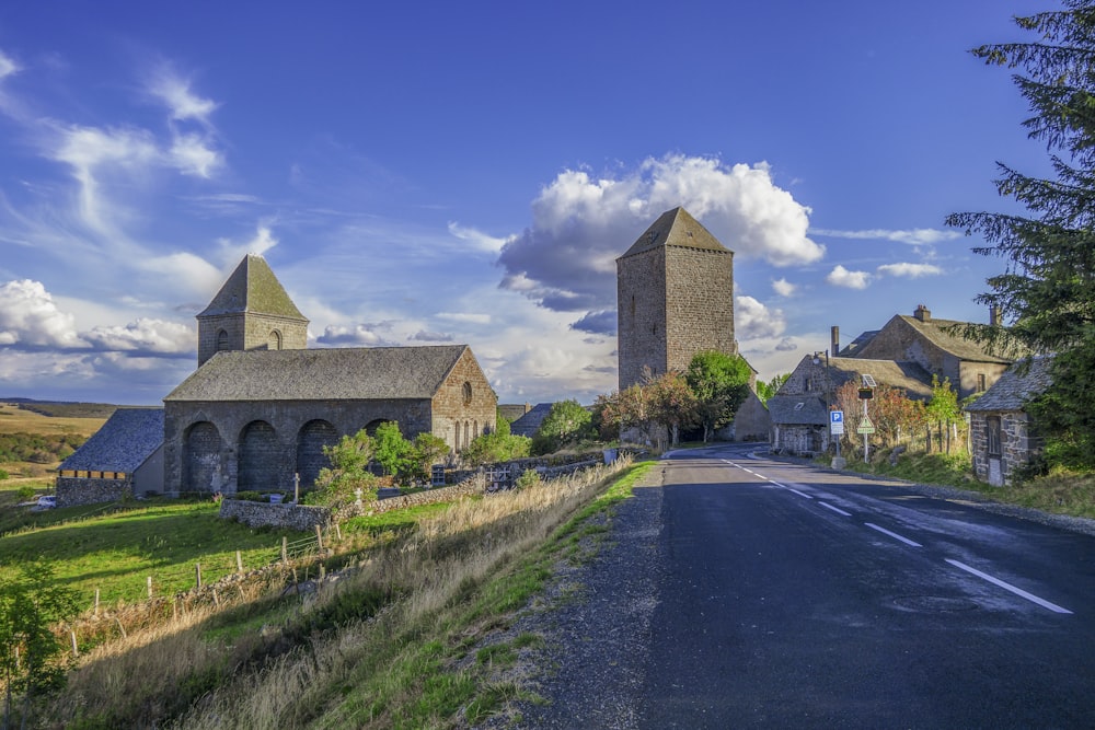 a rural country road lined with stone buildings