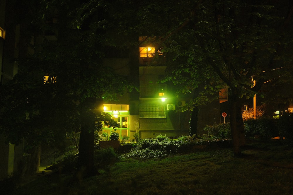 a night time view of a building with lights on