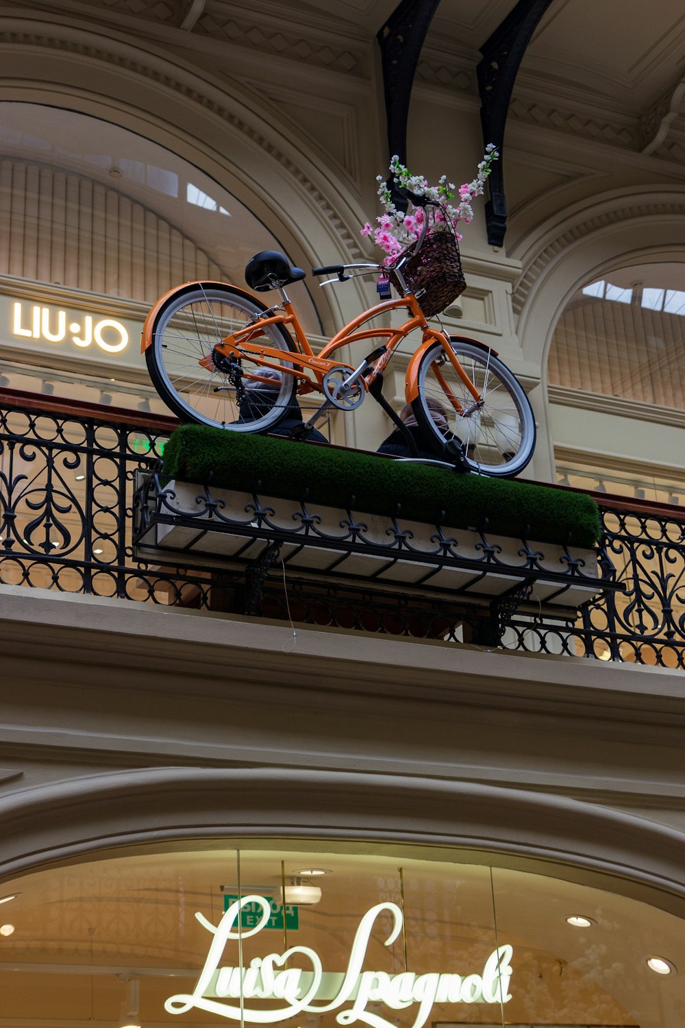 a bicycle is mounted on the top of a building