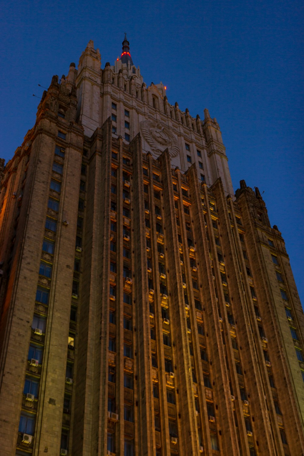 a tall building with a clock on the top of it