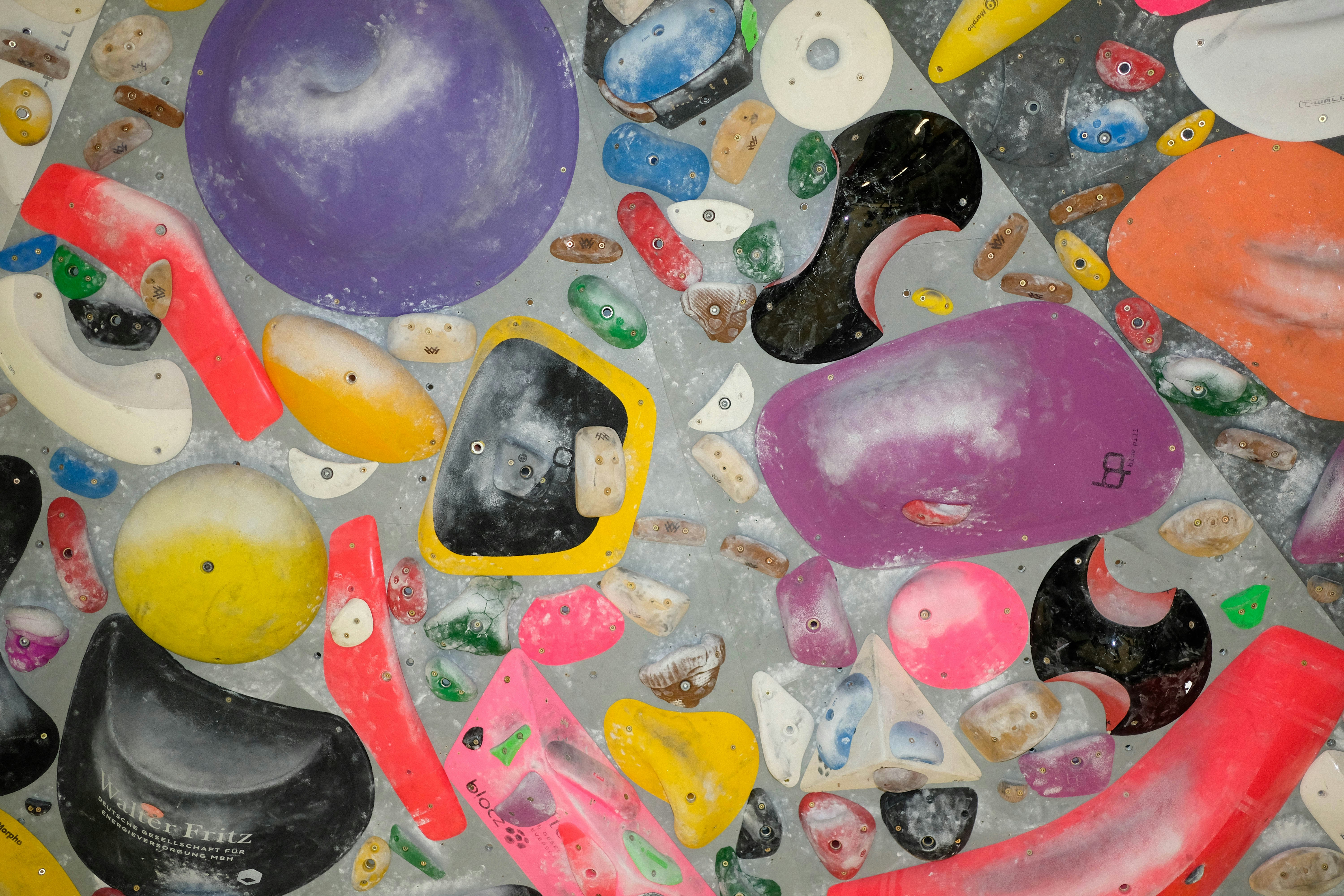 a bunch of different colored objects on a table