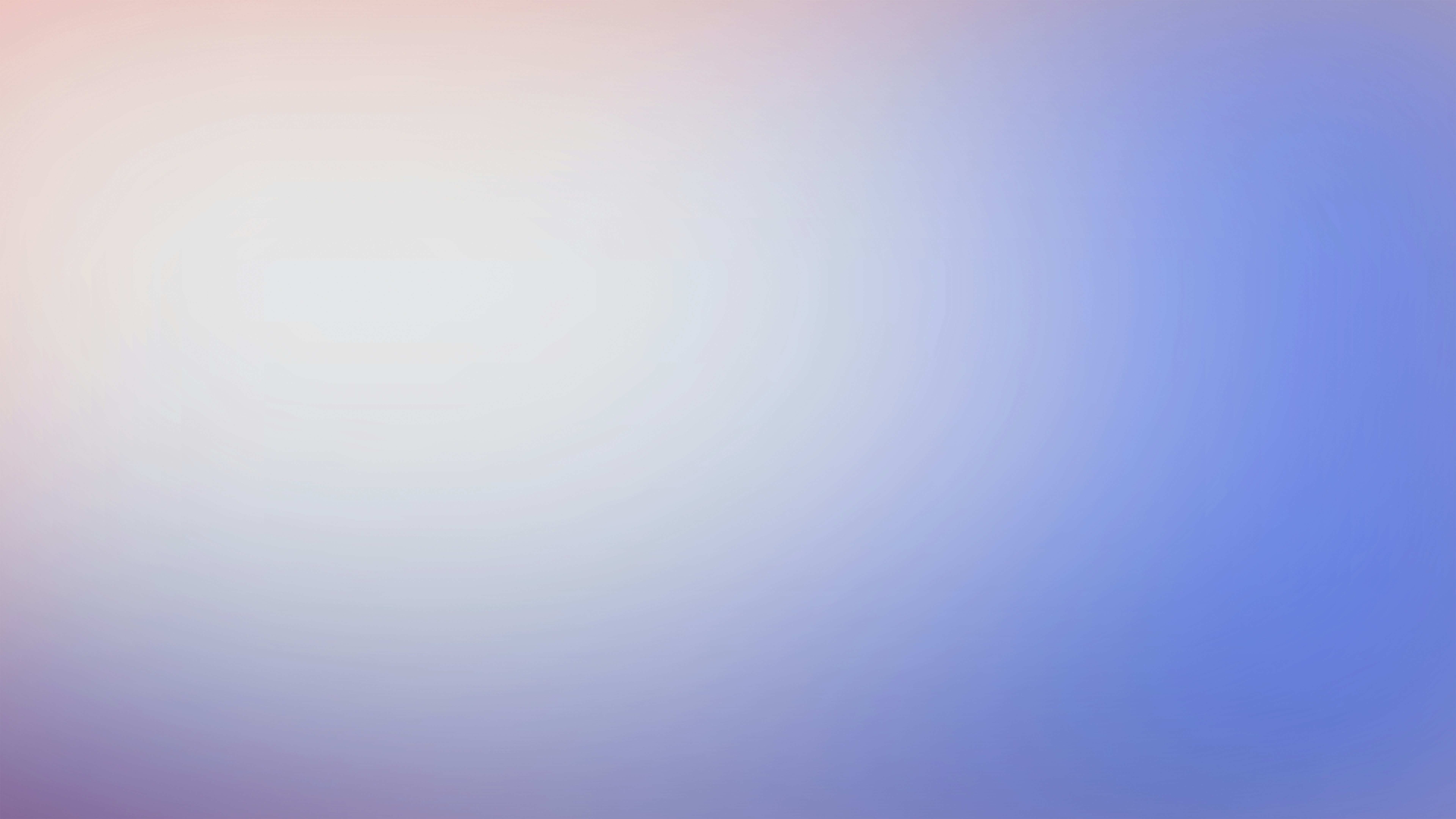 a blurry image of a blue and pink background