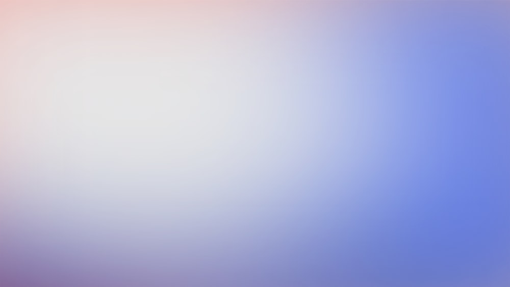 a blurry image of a blue and pink background