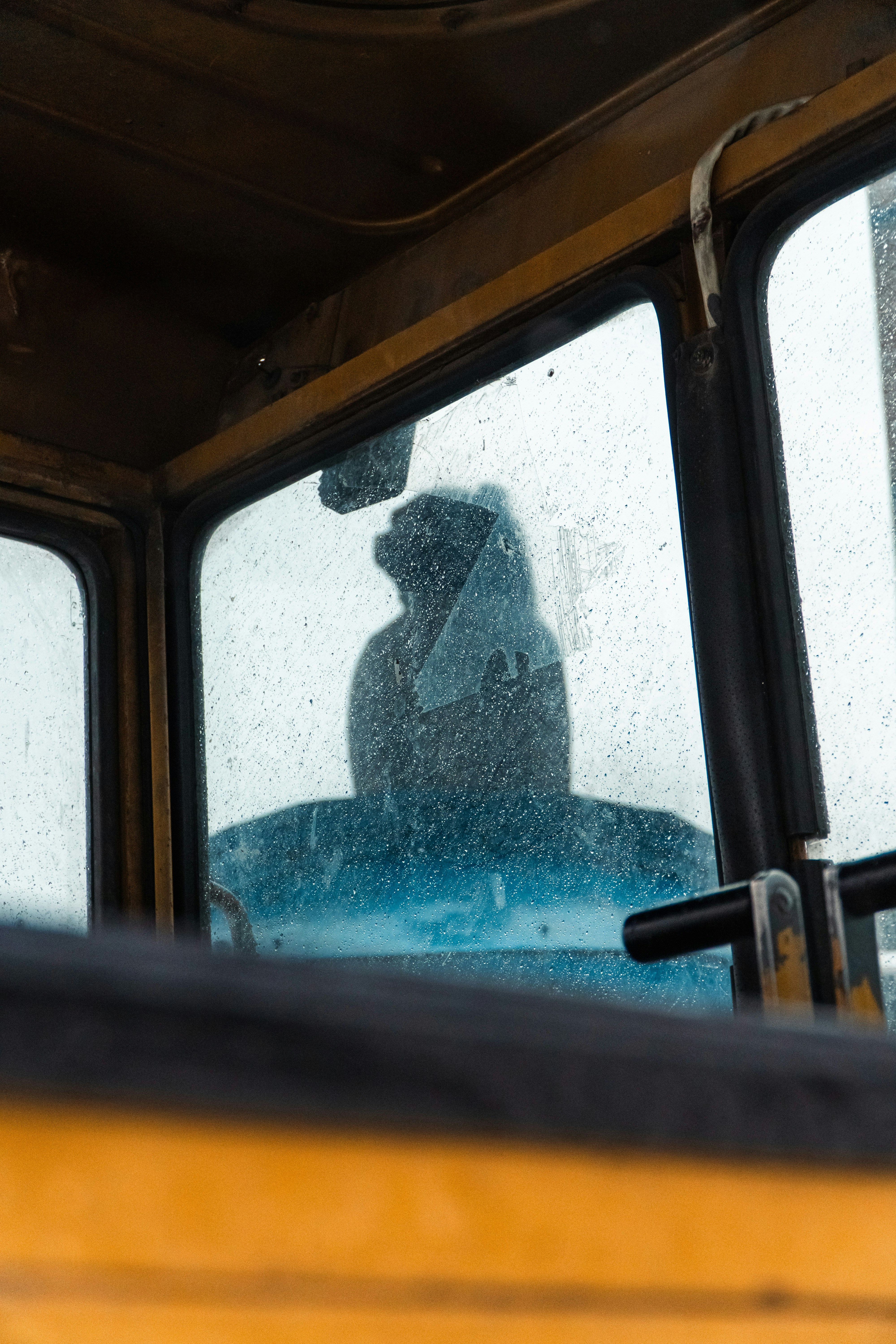A person sitting in a bus looking out the window photo – Free ...