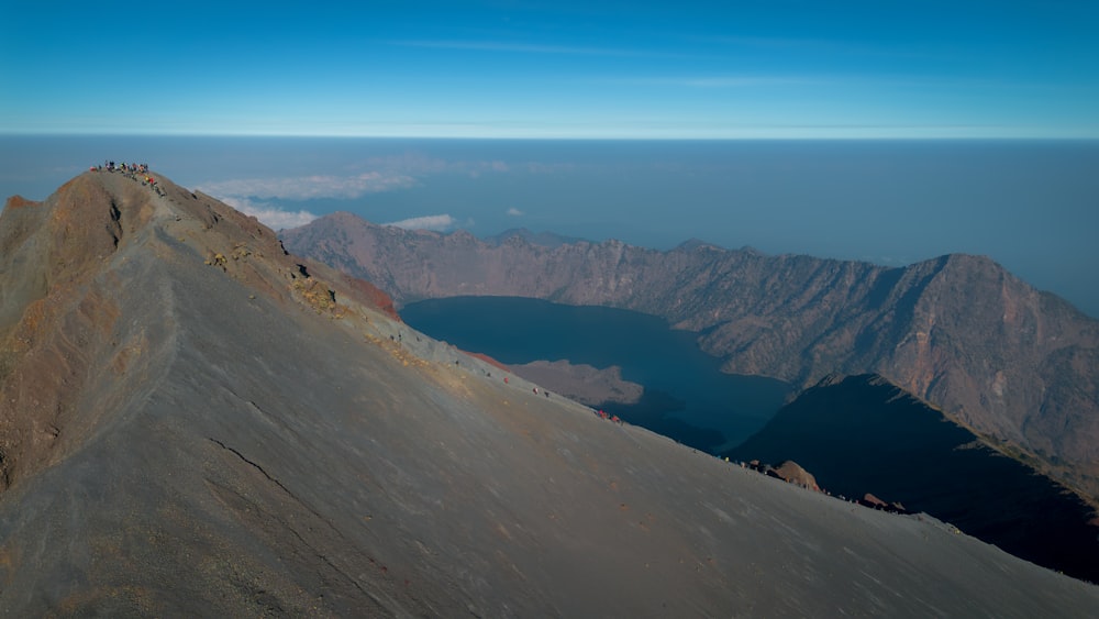 a group of people standing on top of a mountain