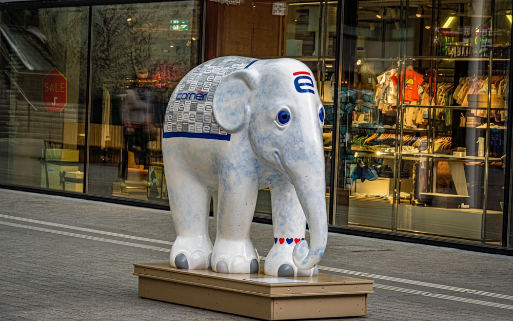 a statue of an elephant on a city street