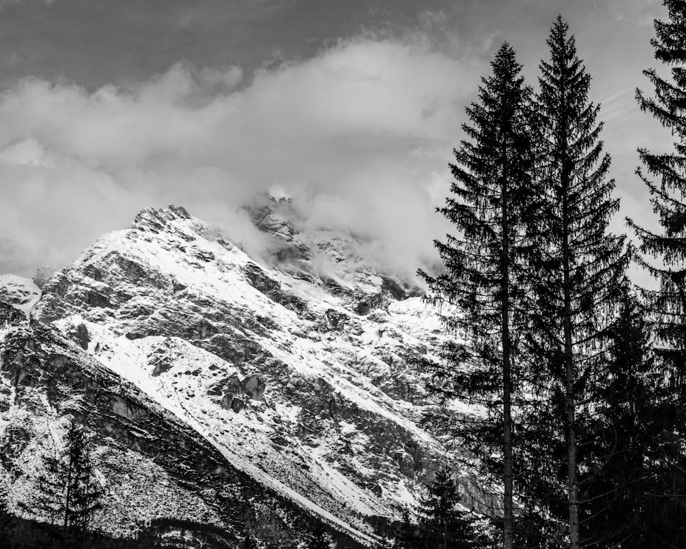 a black and white photo of a snow covered mountain