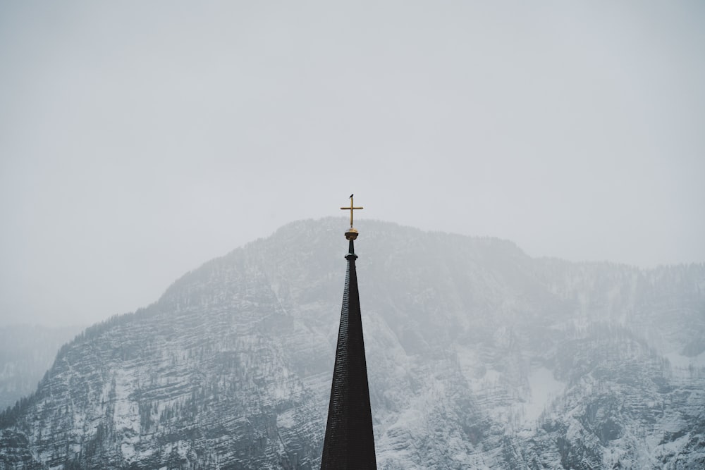 a church steeple with a cross on top of it