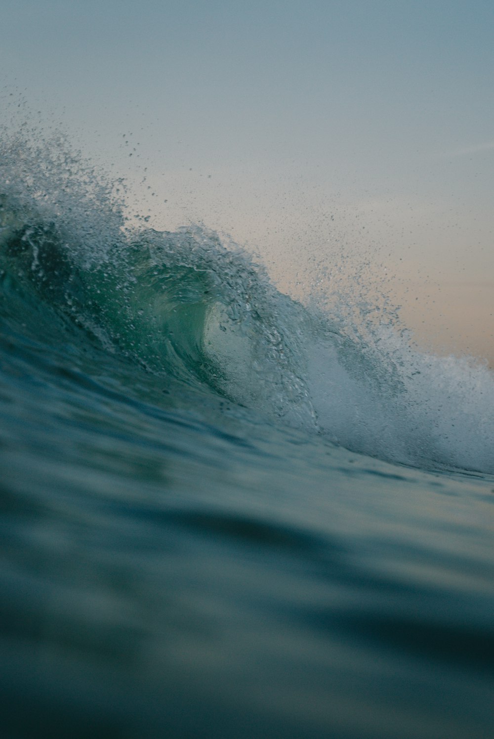 a person riding a wave on top of a surfboard