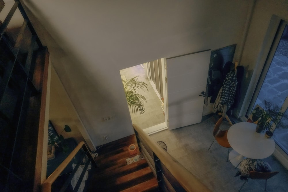 an aerial view of a staircase leading to a bedroom