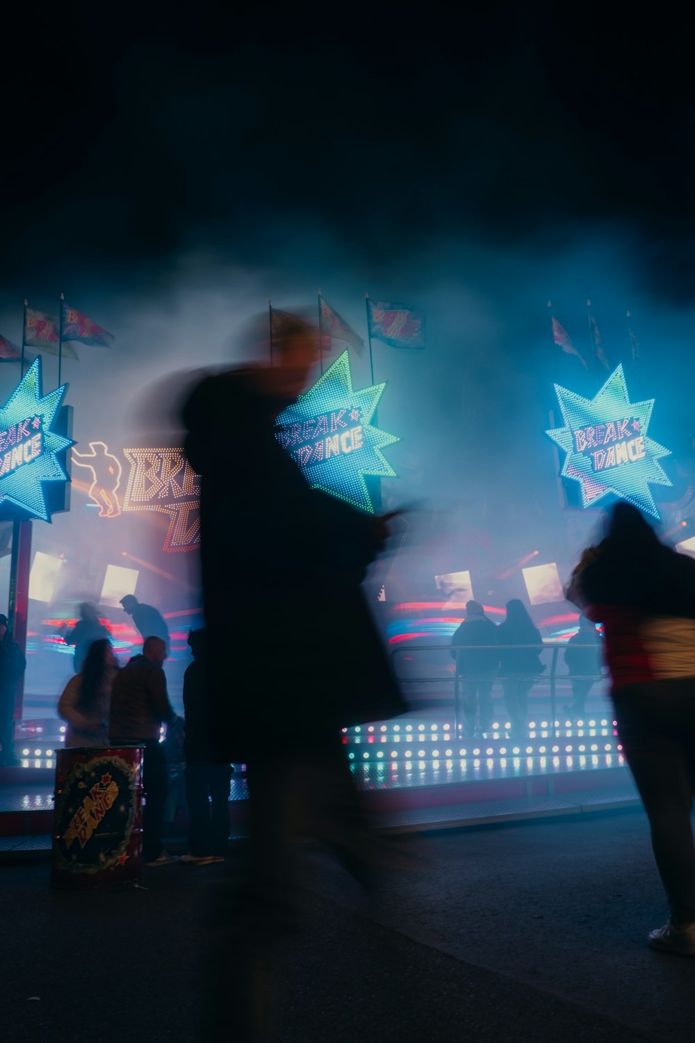 a crowd of people standing around a stage