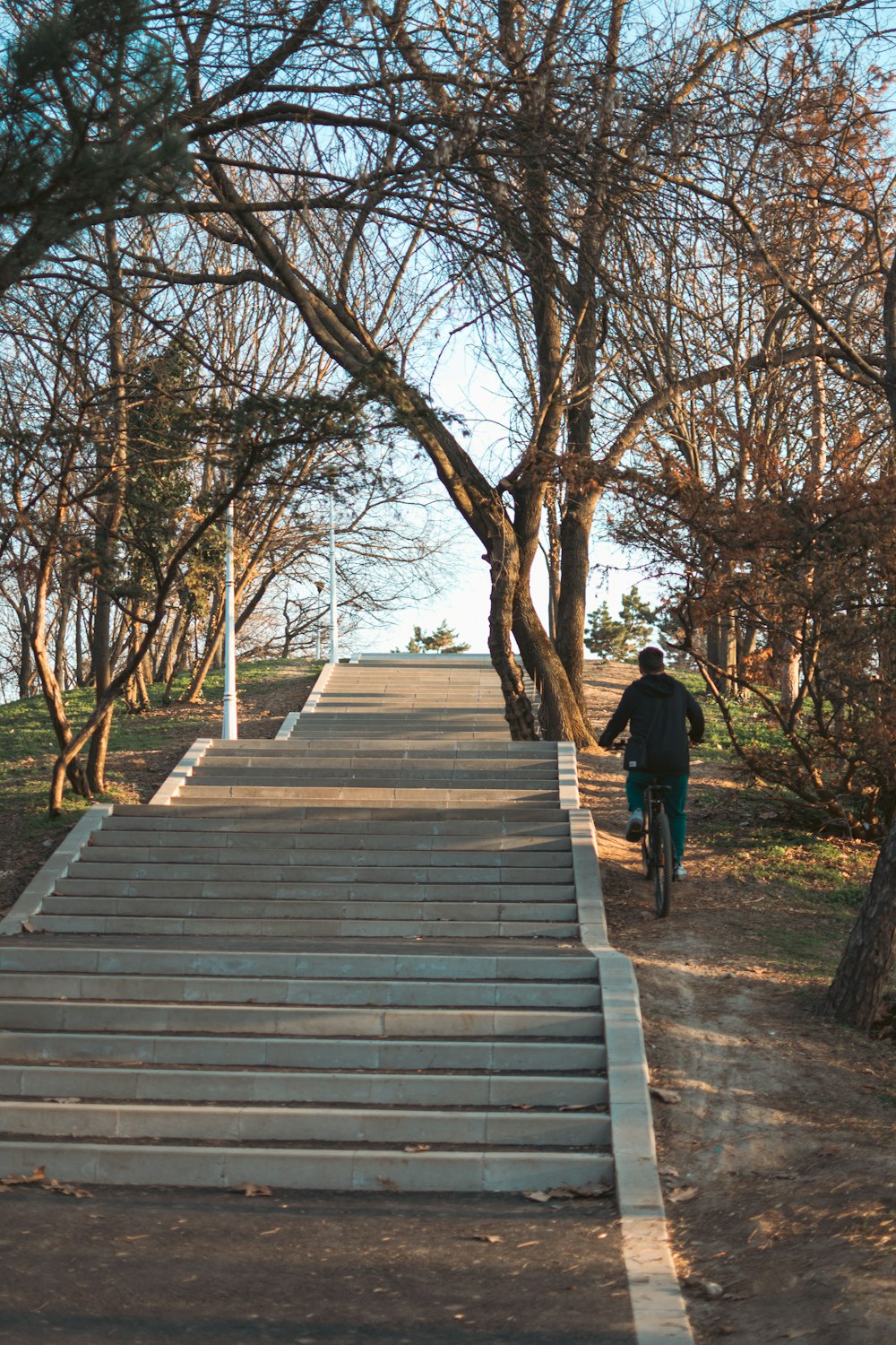 a man riding a skateboard down a set of stairs